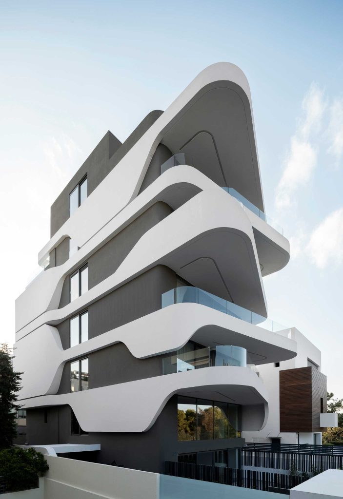 A picture of a futuristic apartment / Multifamily building